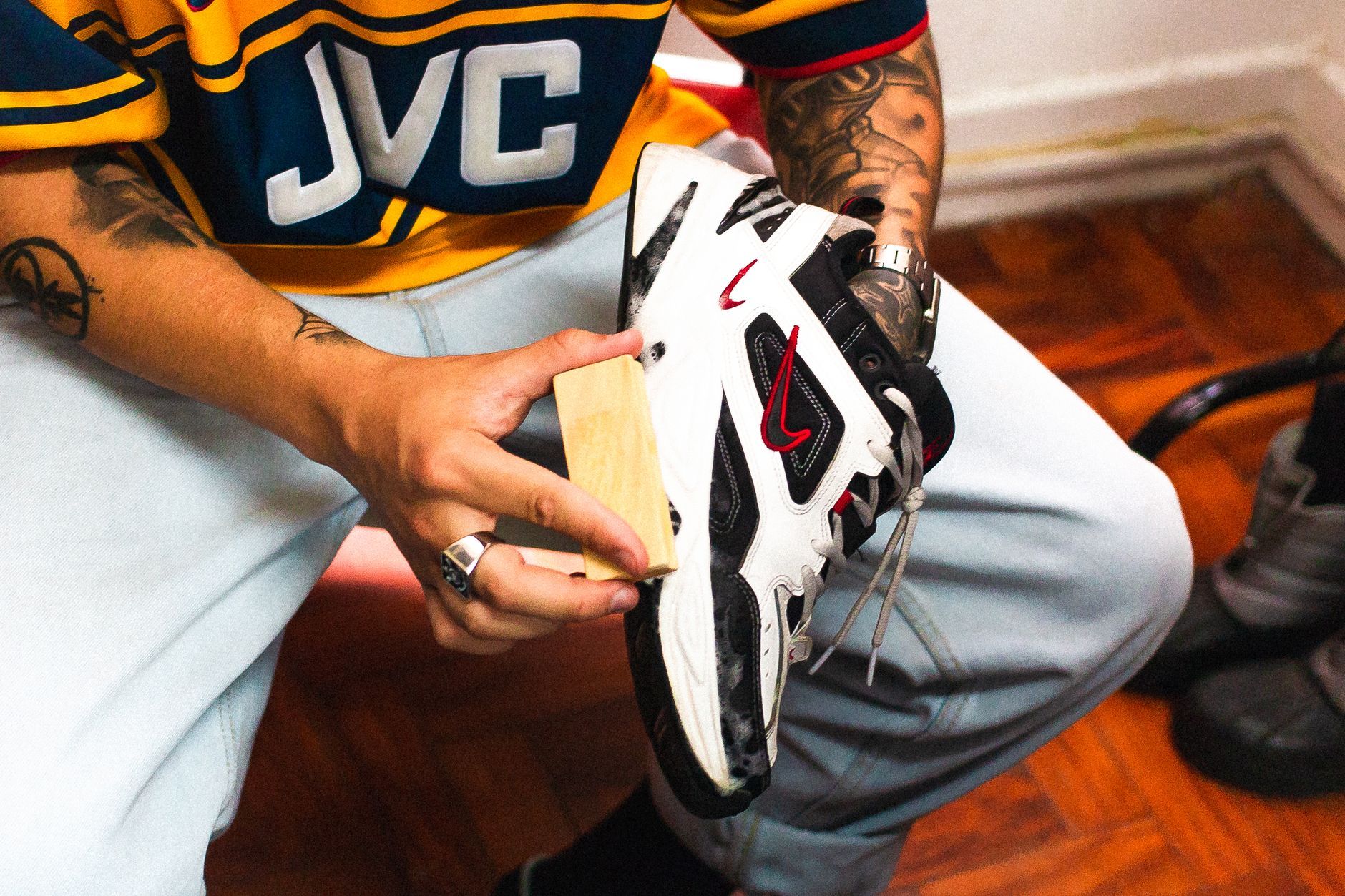 DIY Shoe Cleaner Recipes Hands cleaning shoes with DIY solutions