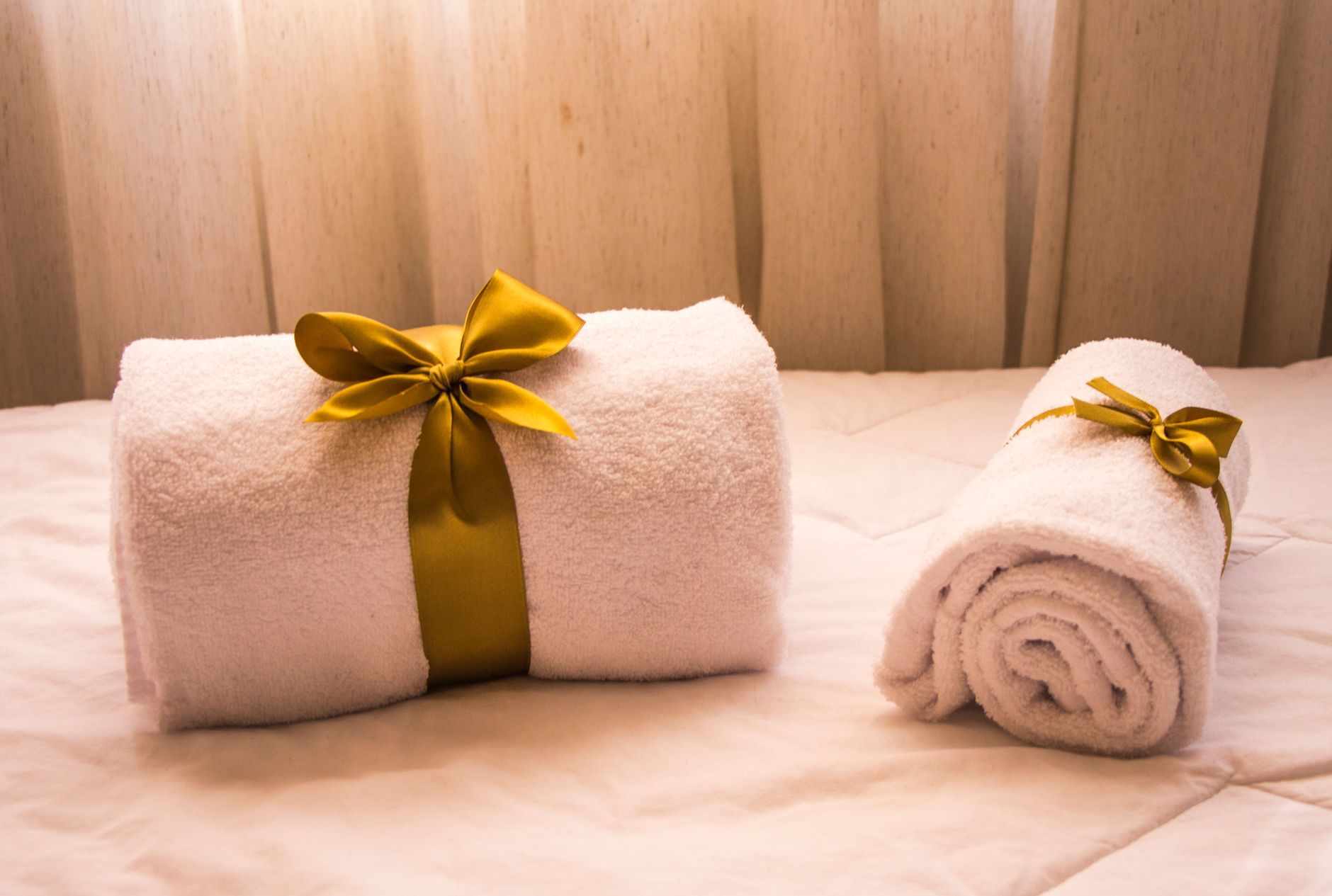 Homemade Tanning Bed Cleaner Recipes Woman cleaning a tanning bed with a spray bottle and cloth